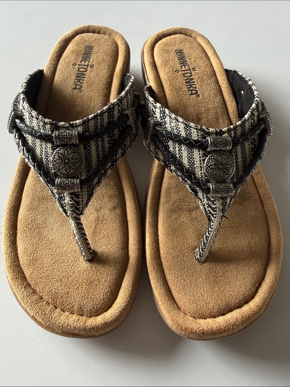Minnetonka Black & Tan Patterned Braided Thong Sandals with Silver Conchos